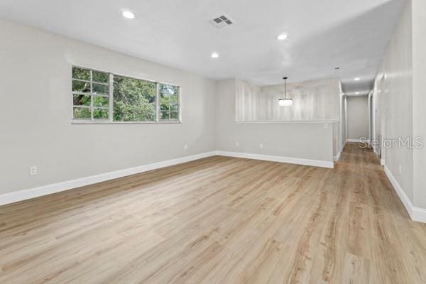 spare room with light wood-type flooring