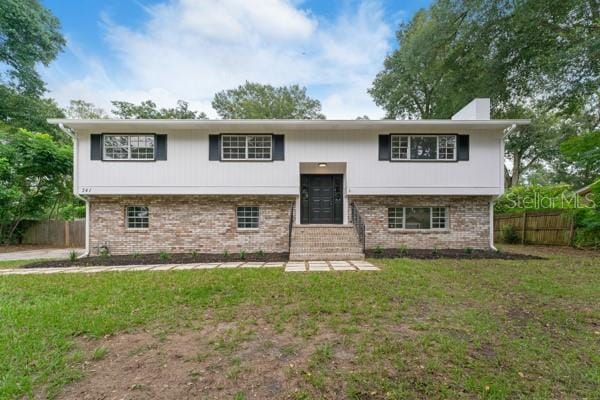 bi-level home with a front yard