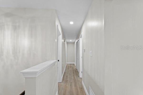 hallway featuring light wood-type flooring