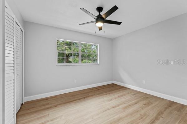 unfurnished bedroom with light wood-type flooring and ceiling fan