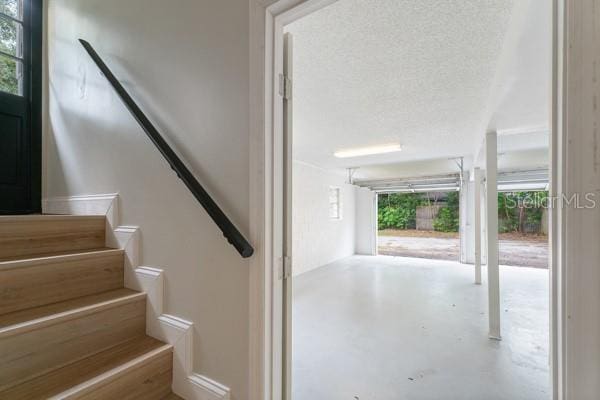 interior space with concrete floors and a textured ceiling