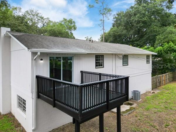 back of property featuring a deck and central air condition unit