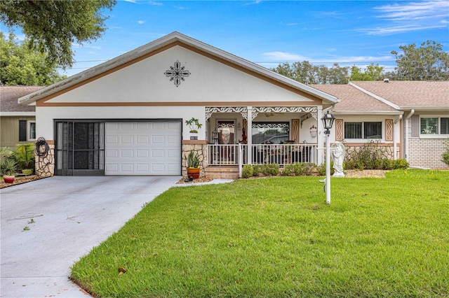 view of front of home featuring a front yard, a garage, and a porch