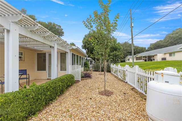 view of yard featuring a patio area and a pergola