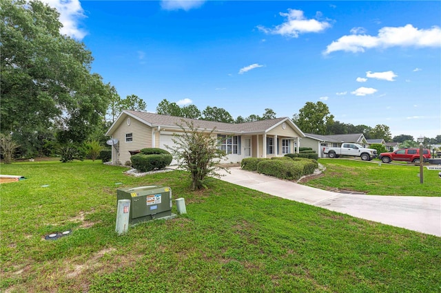 single story home featuring a garage and a front yard