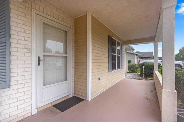 property entrance featuring covered porch