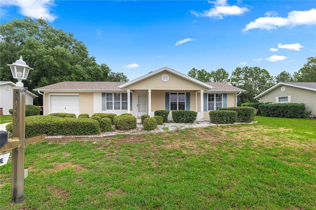 single story home with a garage and a front yard