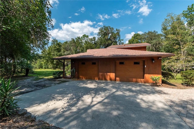 view of side of property featuring a garage