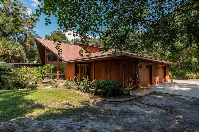 view of property exterior with a lawn