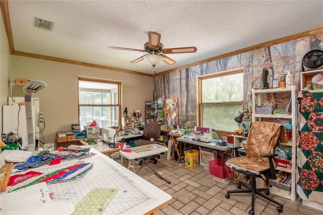 bedroom featuring multiple windows, crown molding, ceiling fan, and a textured ceiling