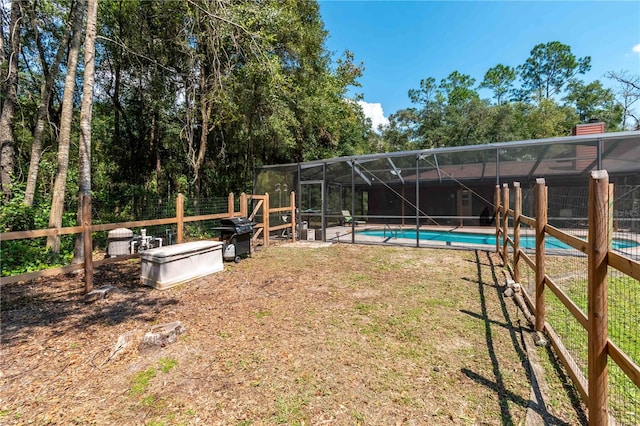 view of yard featuring a lanai