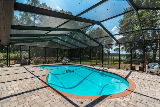 view of pool with a lanai and a patio area