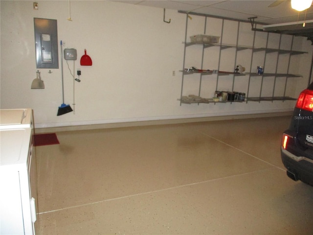 garage featuring washer / clothes dryer and electric panel