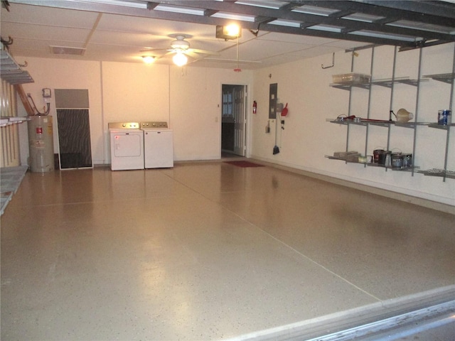 garage featuring separate washer and dryer, electric panel, electric water heater, and ceiling fan