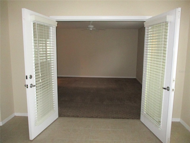 corridor with light tile patterned floors