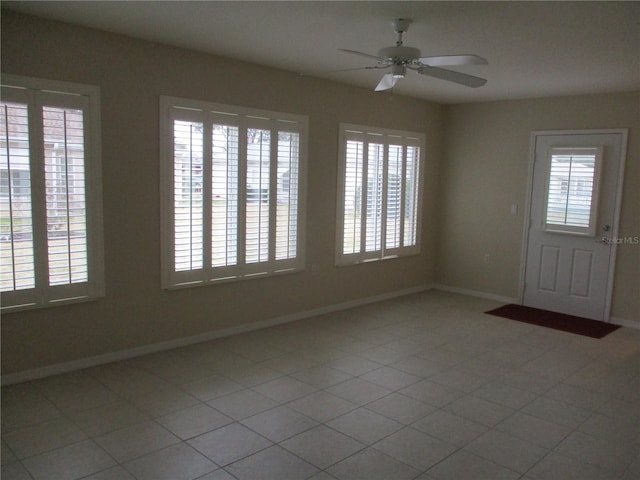 tiled foyer entrance featuring ceiling fan