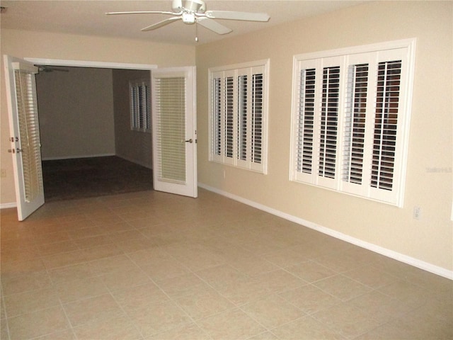 unfurnished bedroom featuring light tile patterned flooring, ceiling fan, and a closet