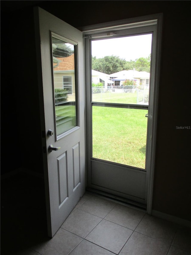 entryway featuring light tile patterned floors