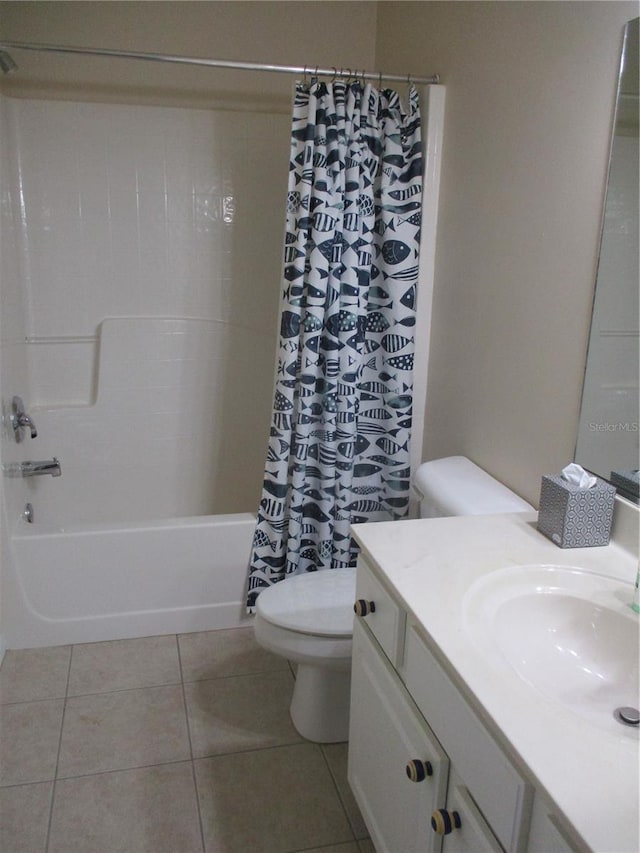 full bathroom with tile patterned flooring, vanity, toilet, and shower / tub combo with curtain