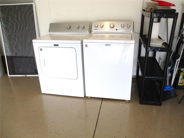 clothes washing area with washer and clothes dryer