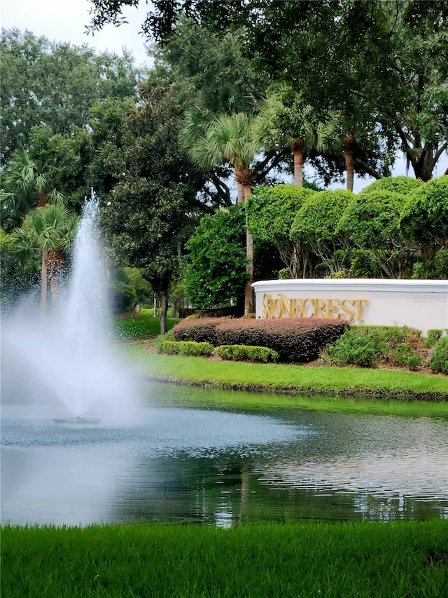 community sign with a water view