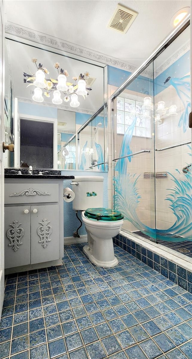 bathroom featuring visible vents, vanity, toilet, and tile patterned floors