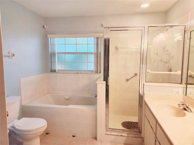 full bathroom with toilet, shower with separate bathtub, vanity, and tile patterned floors