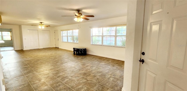 17808 SE 115th Ct, Summerfield, FL 34491 - empty room featuring a ceiling fan and baseboards
