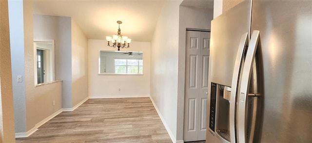 17808 SE 115th Ct, Summerfield, FL 34491 - corridor with a chandelier, wood finished floors, baseboards, and lofted ceiling