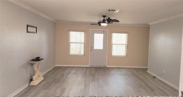 17808 SE 115th Ct, Summerfield, FL 34491 - entrance foyer with ceiling fan, crown molding, wood finished floors, and baseboards