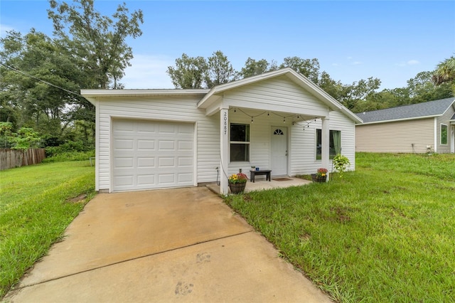 view of front facade with a front lawn and a garage