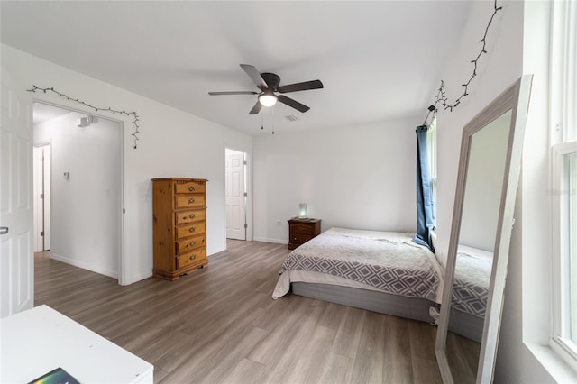 bedroom featuring ceiling fan and wood-type flooring