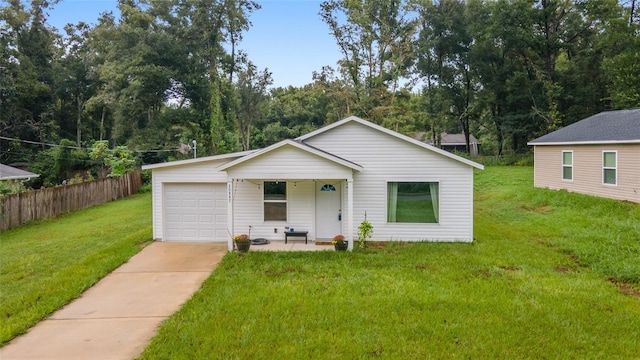 view of front of home with a garage and a front lawn