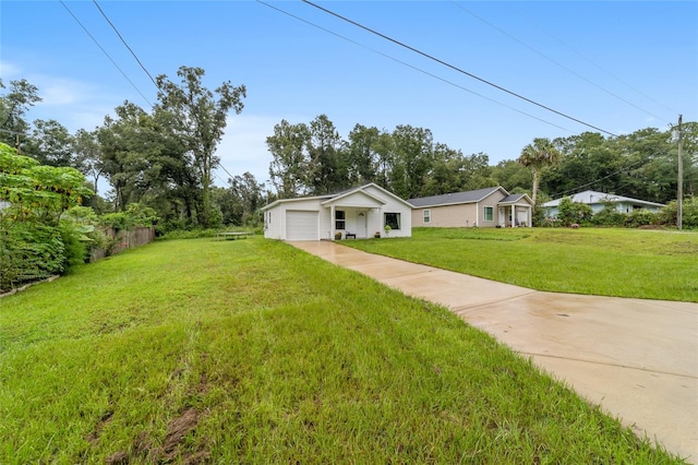 single story home with a front yard and a garage