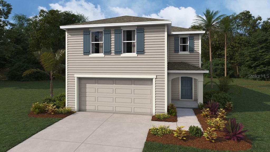 view of property with a garage and a front lawn