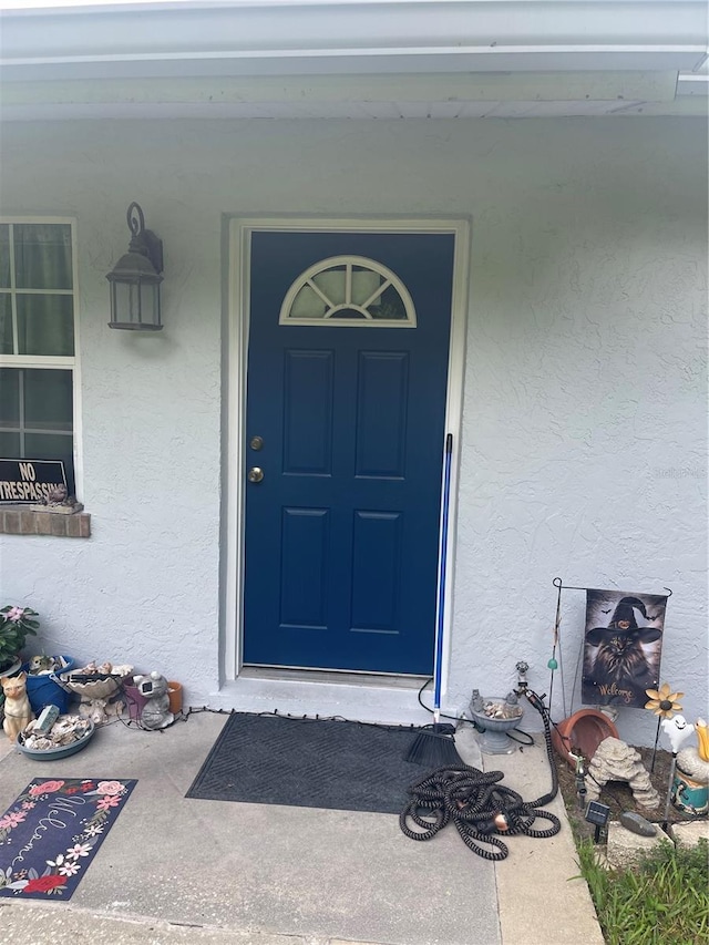 property entrance featuring covered porch