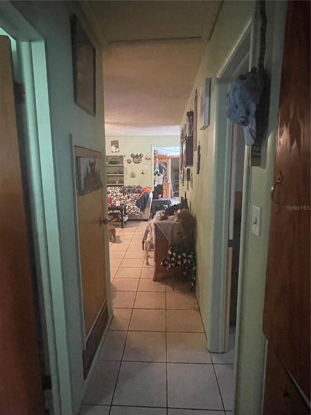 hallway with light tile patterned floors