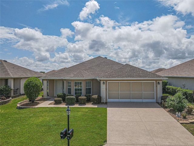 ranch-style home with a front yard and a garage