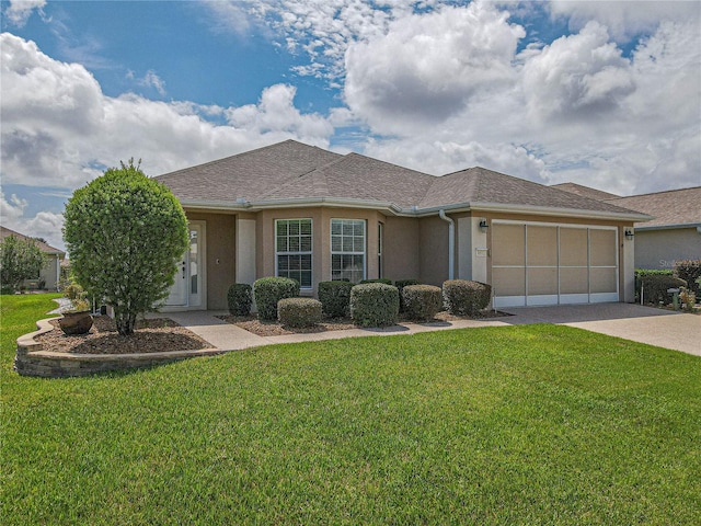 ranch-style house featuring a front lawn and a garage