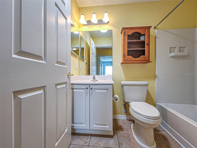 full bathroom with tiled shower / bath combo, tile patterned flooring, vanity, and toilet