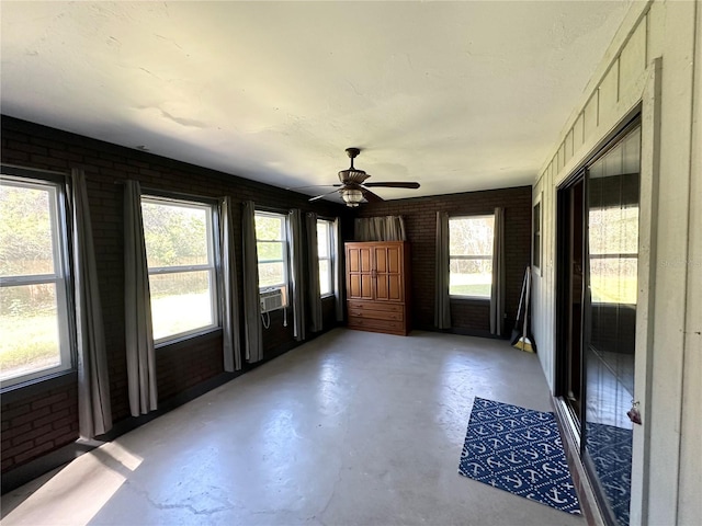 unfurnished sunroom with cooling unit