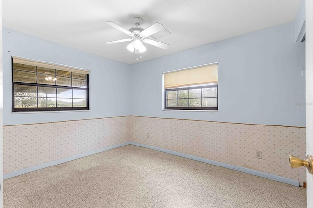 spare room with ceiling fan