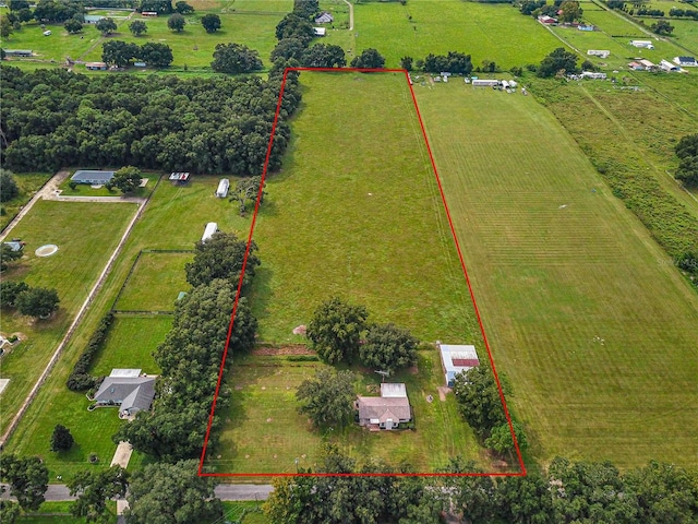 birds eye view of property with a rural view