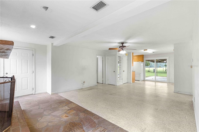 unfurnished living room with ceiling fan and beam ceiling