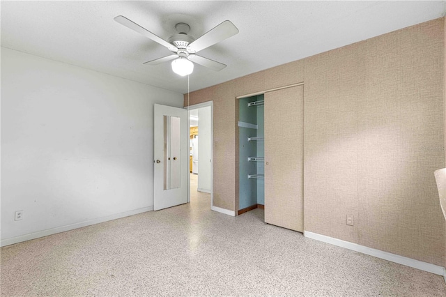 unfurnished bedroom featuring ceiling fan and a closet