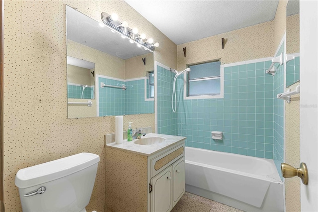 full bathroom featuring vanity, toilet, and tiled shower / bath combo