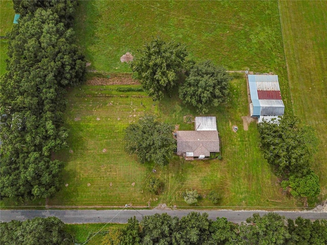 birds eye view of property featuring a rural view