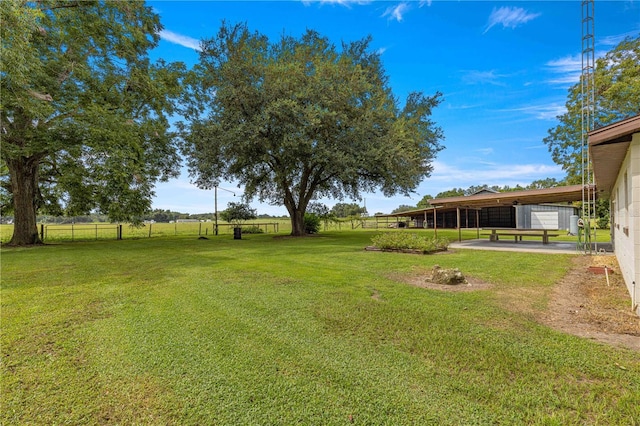 view of yard with a rural view