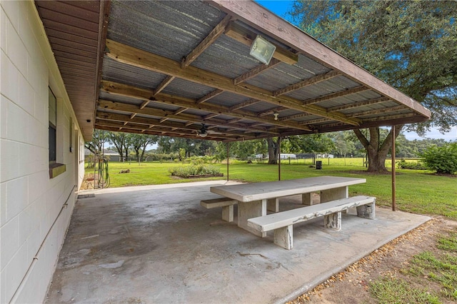 view of home's community with a patio and a lawn