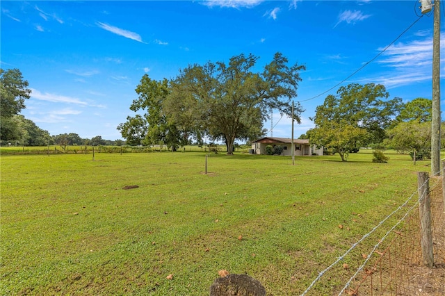 view of yard with a rural view